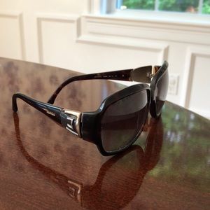 A pair of MaxMara sunglasses.
